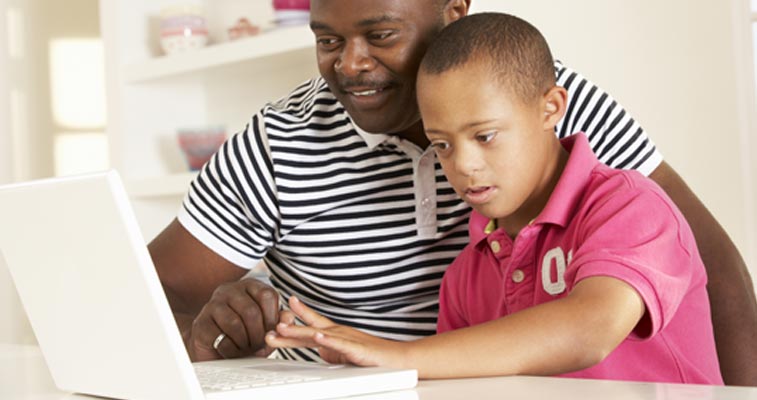 Father and son reviewing website