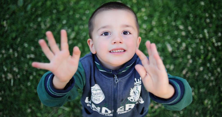 boy reaching out